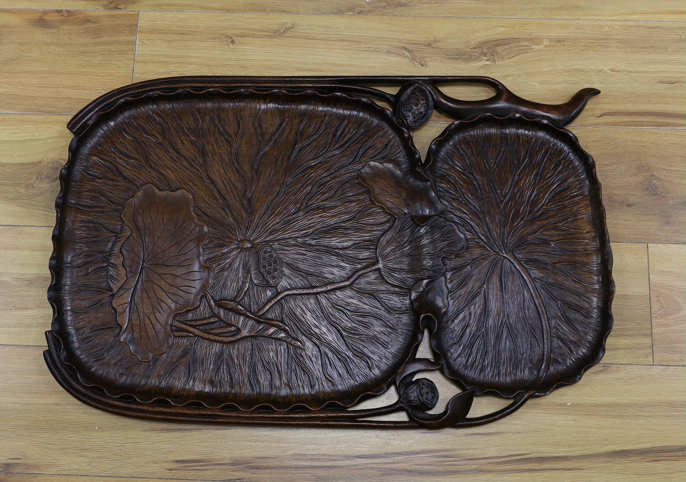 A Japanese carved hardwood lotus flower tray, 72cm wide